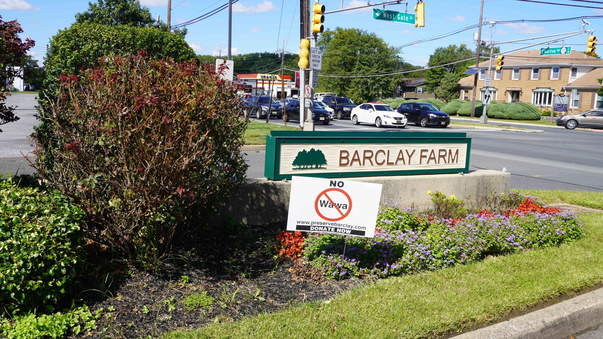 XXX09292021 BARCLAY FARM MEDIAN WITH WAWA PROTEST SIGN.JPG